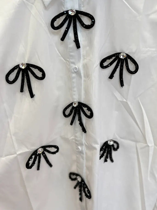 WHITE SHIRT WITH SHINY BOWS