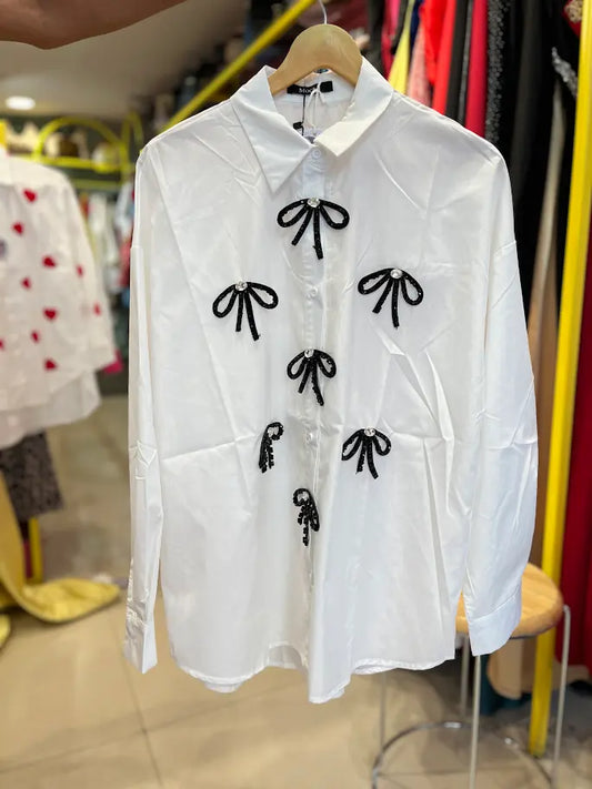 WHITE SHIRT WITH SHINY BOWS